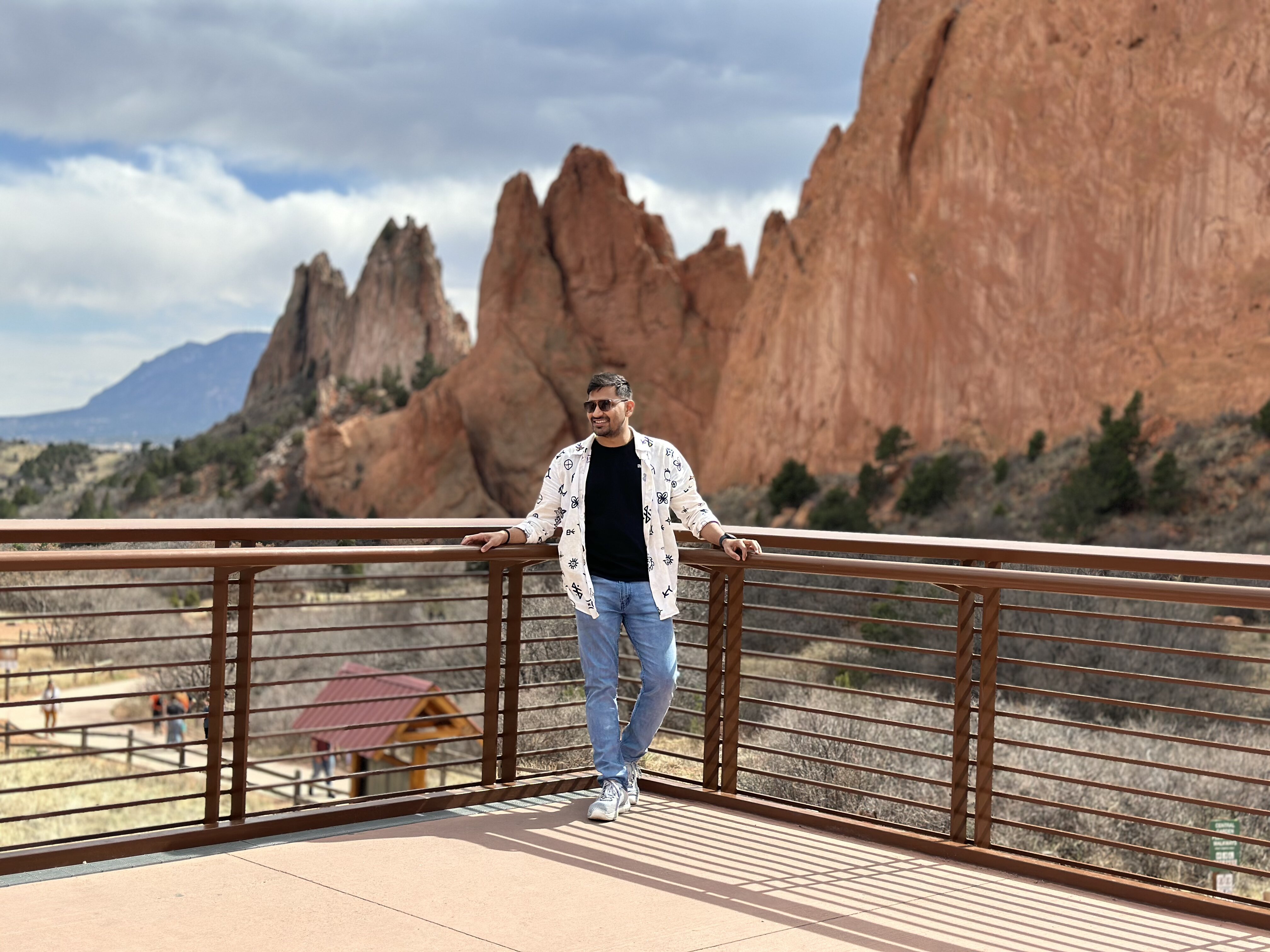 Vividh leaning on a railing at Garden of the Gods