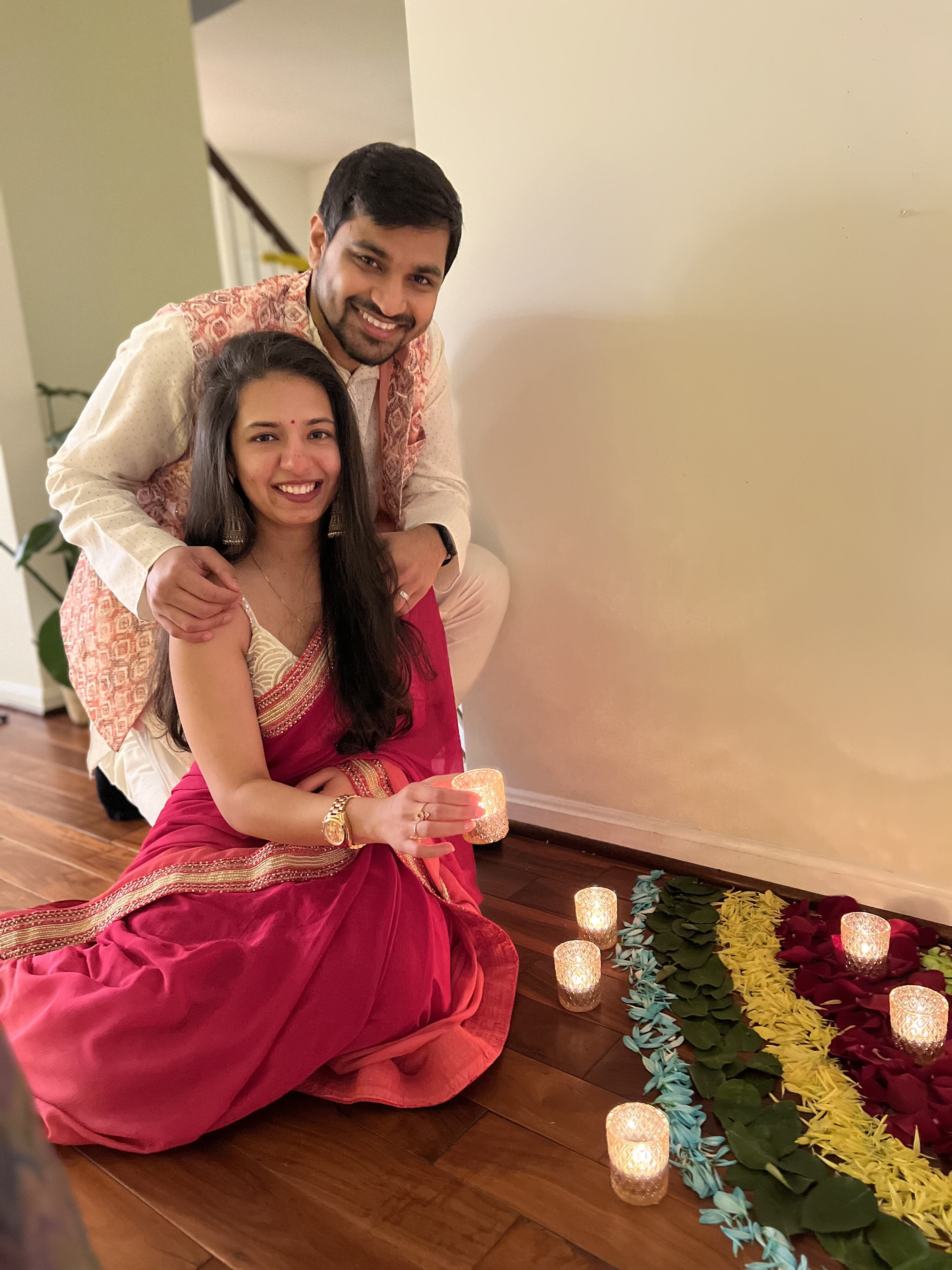 Vividh and his wife lighting diyas for Diwali